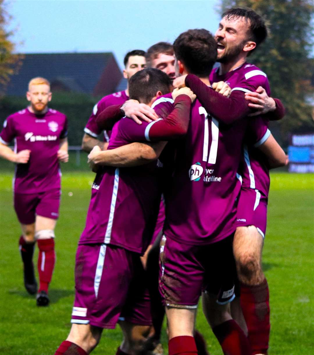 Bourne celebrate their third goal. Photo: Dave Mears