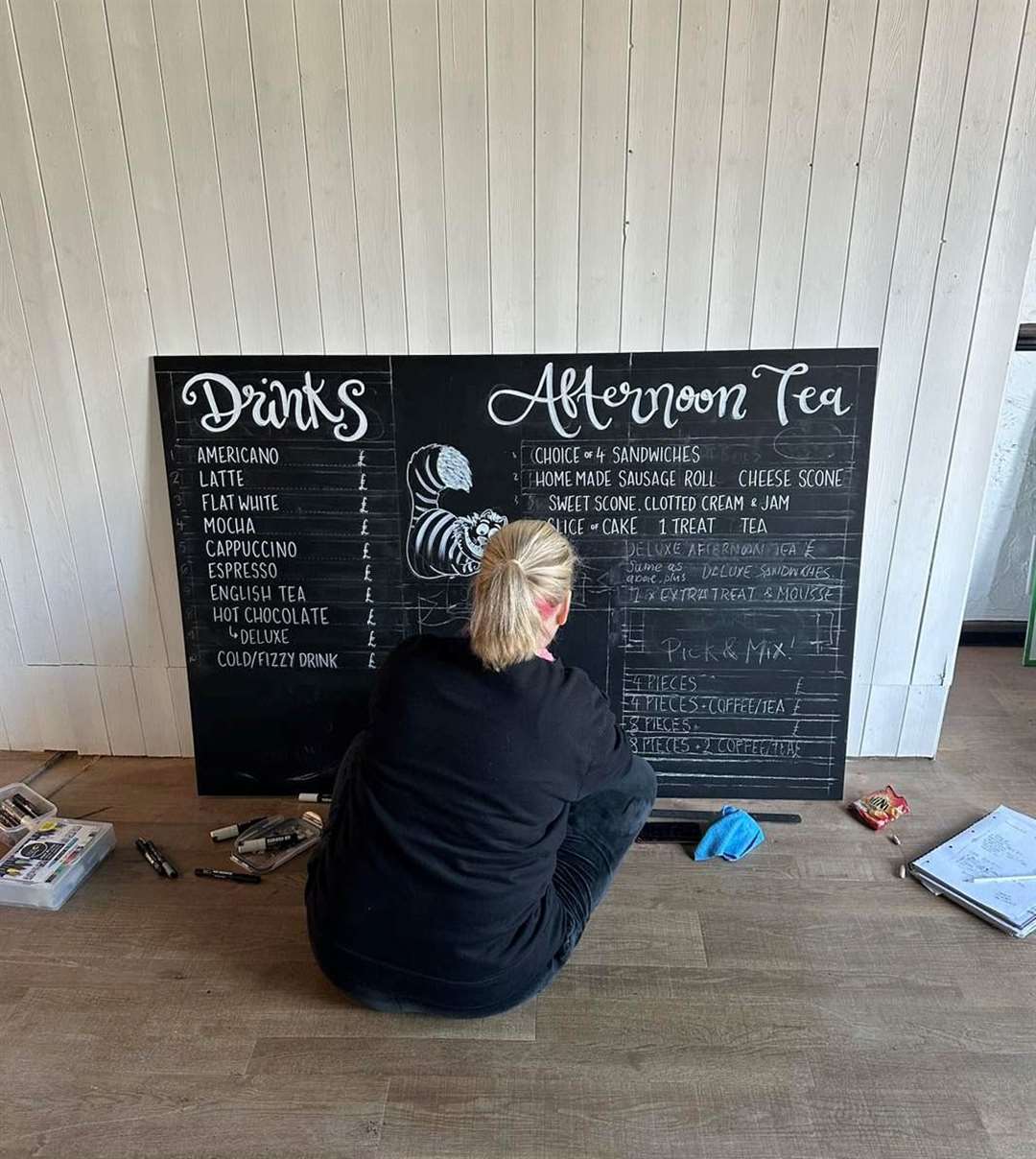 Sign writer designs the board