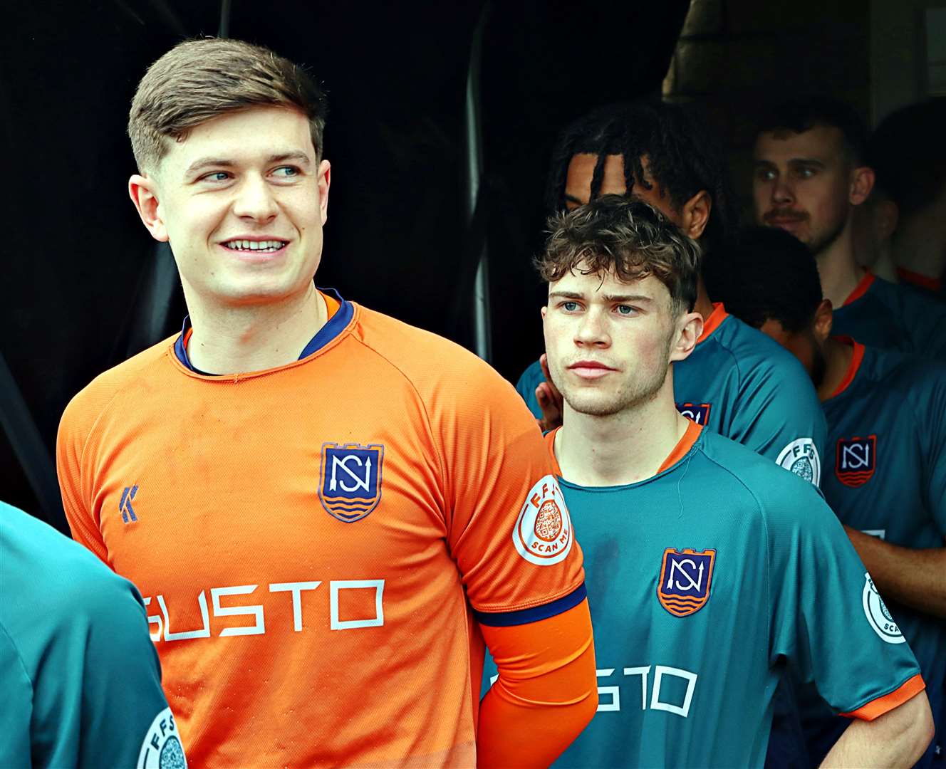 The players come out of the tunnel.