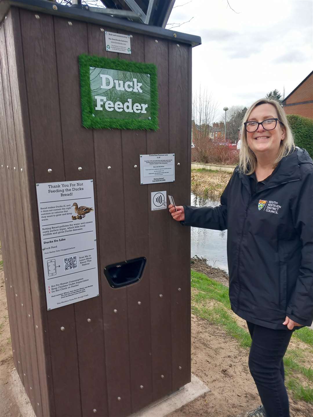 SKDC Parks Officer Sharon Haythorn at the Wyndham Park bird feeder. Photo: SKDC