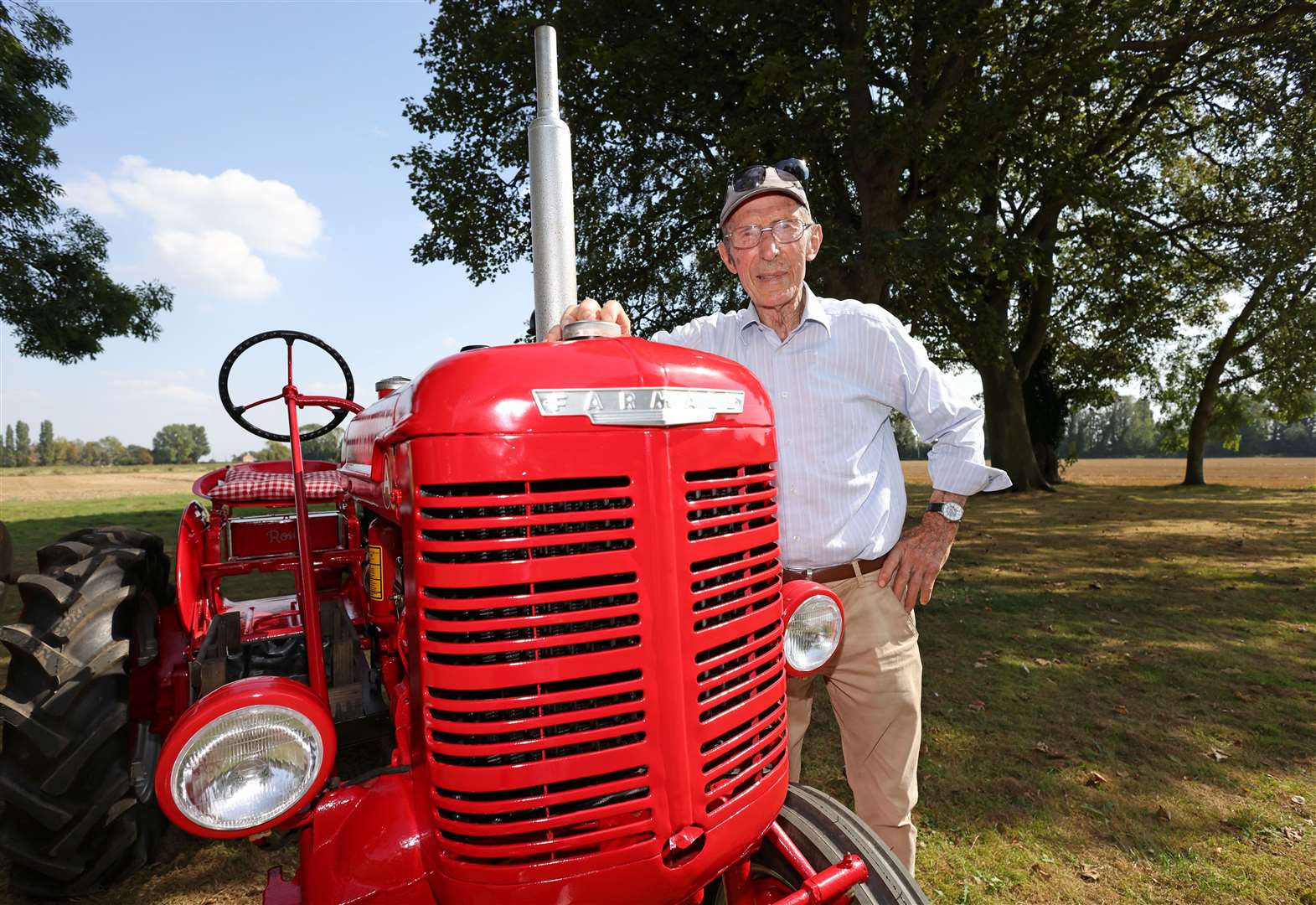Jim Peach with a very shiny red tractor