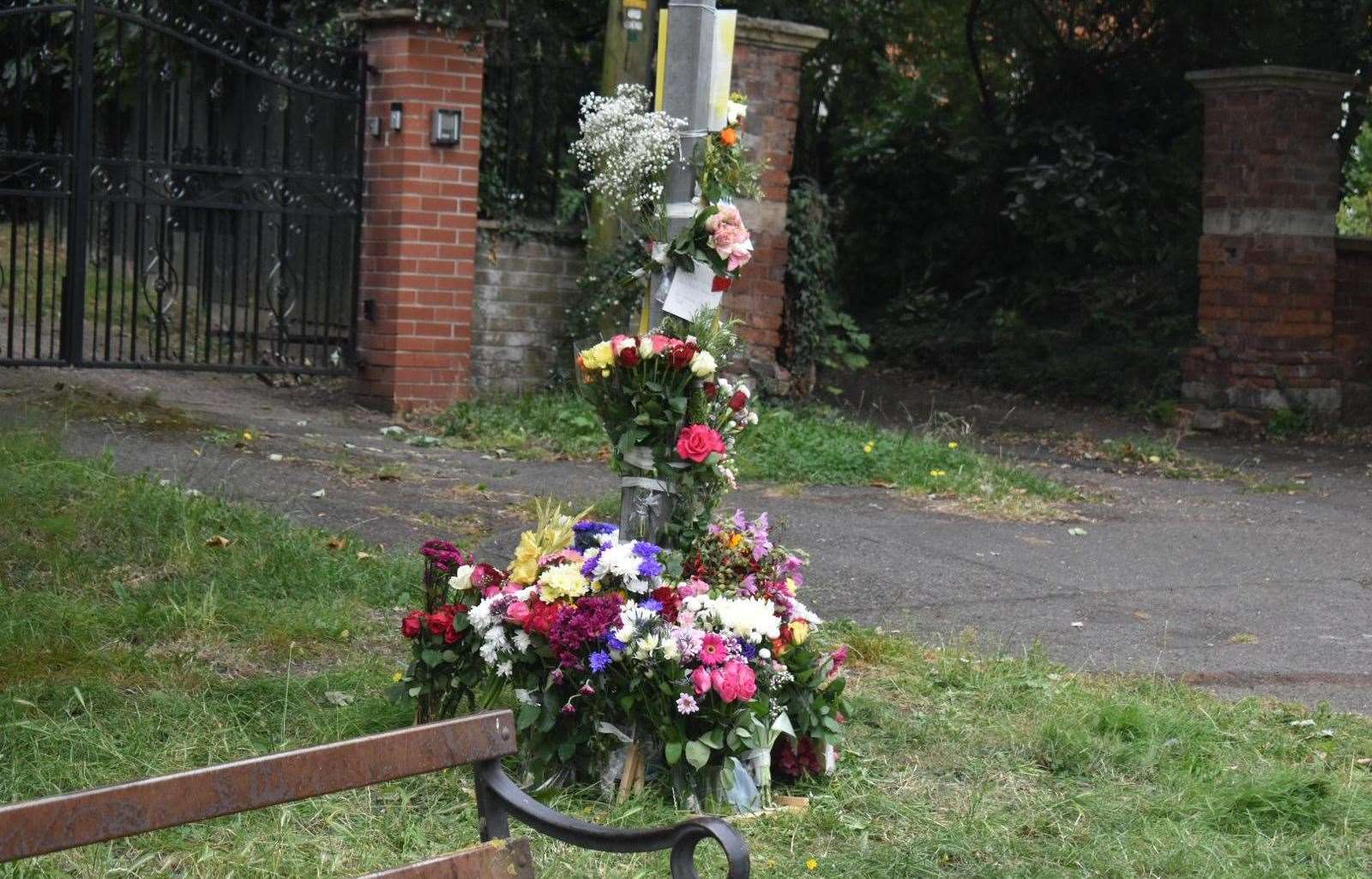 Floral tributes left for Lijuan Wu following the incident.