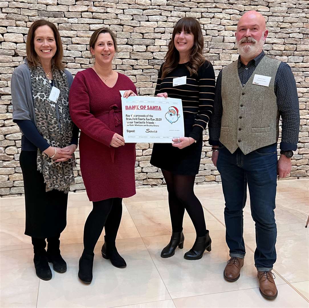 Jo Coulter and Pip Tiffin from MindSpace Stamford receiving last year’s donation from the event, from Liz Harding and Andy Wade