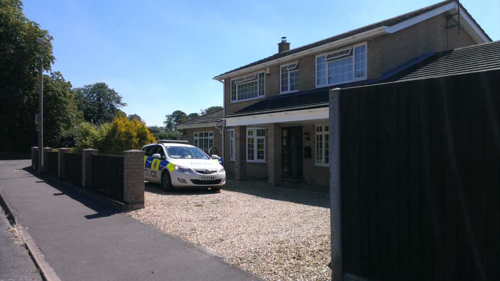 Police at the house in Moulton.