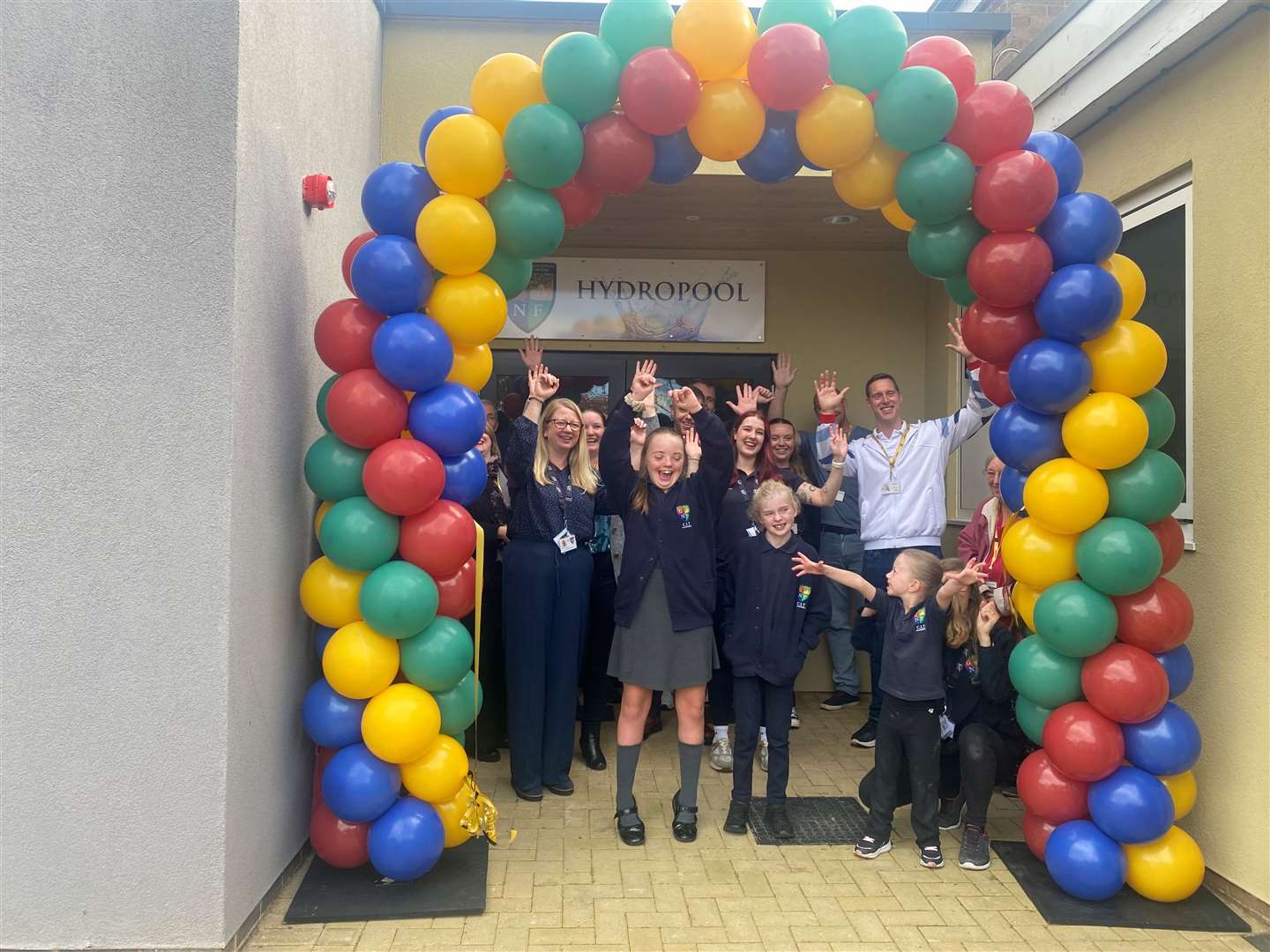 Happy children and staff at the opening of the hydropool!