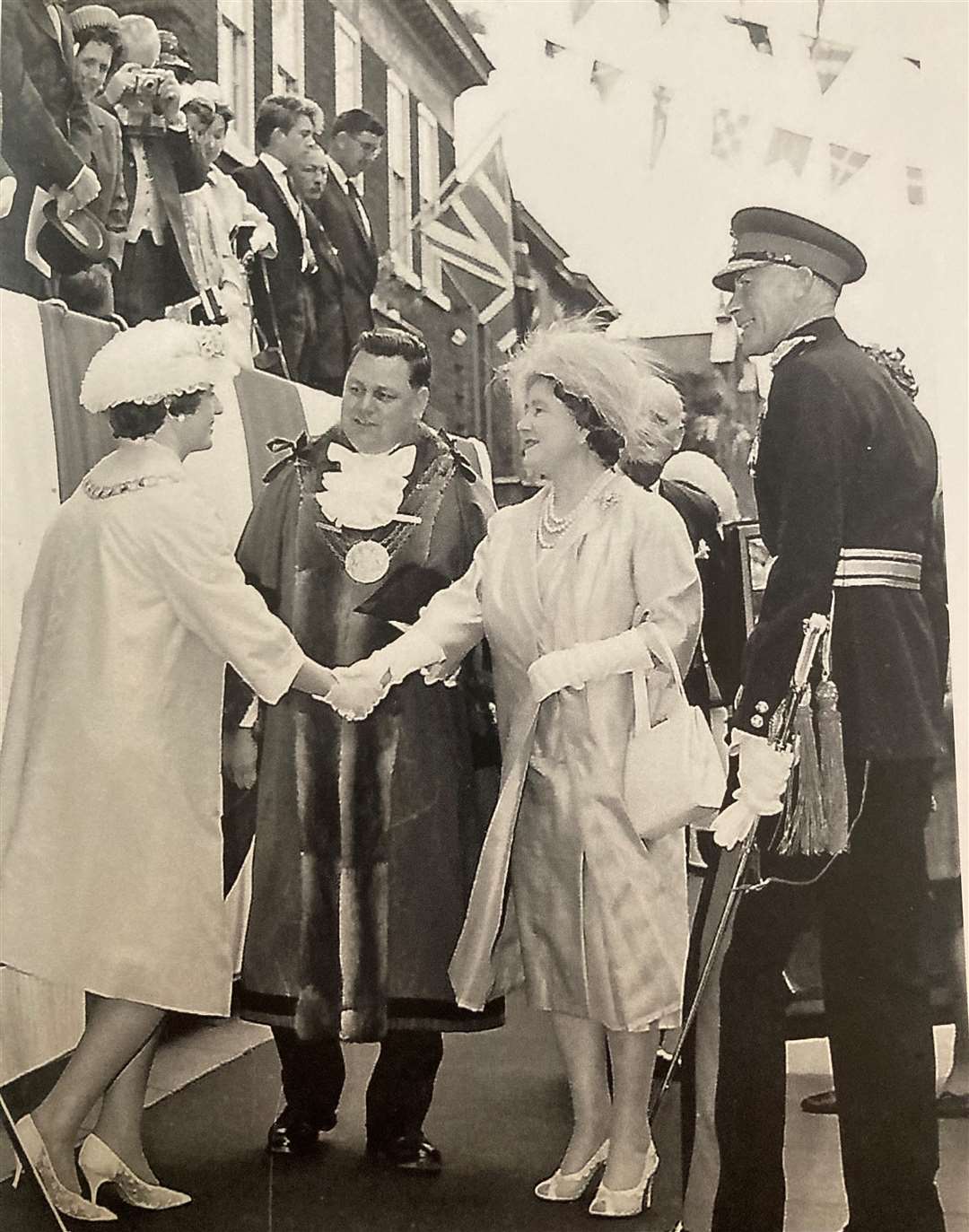 Joan when she met the Queen Mother.