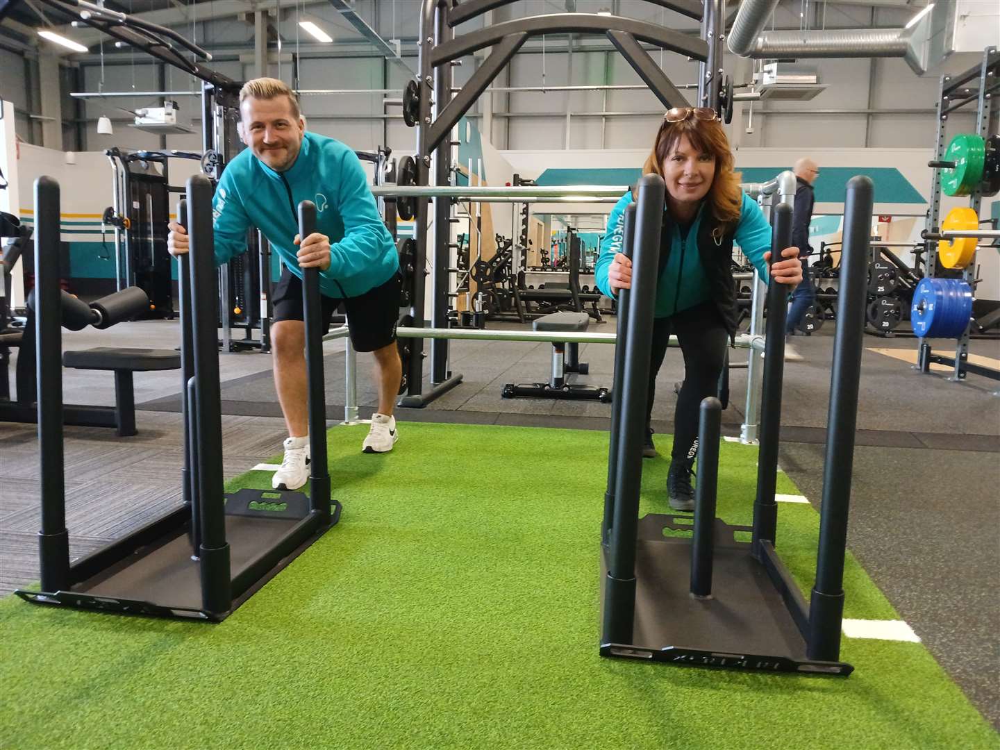Rob Hope and Isla Oliver try out the sled push without weights