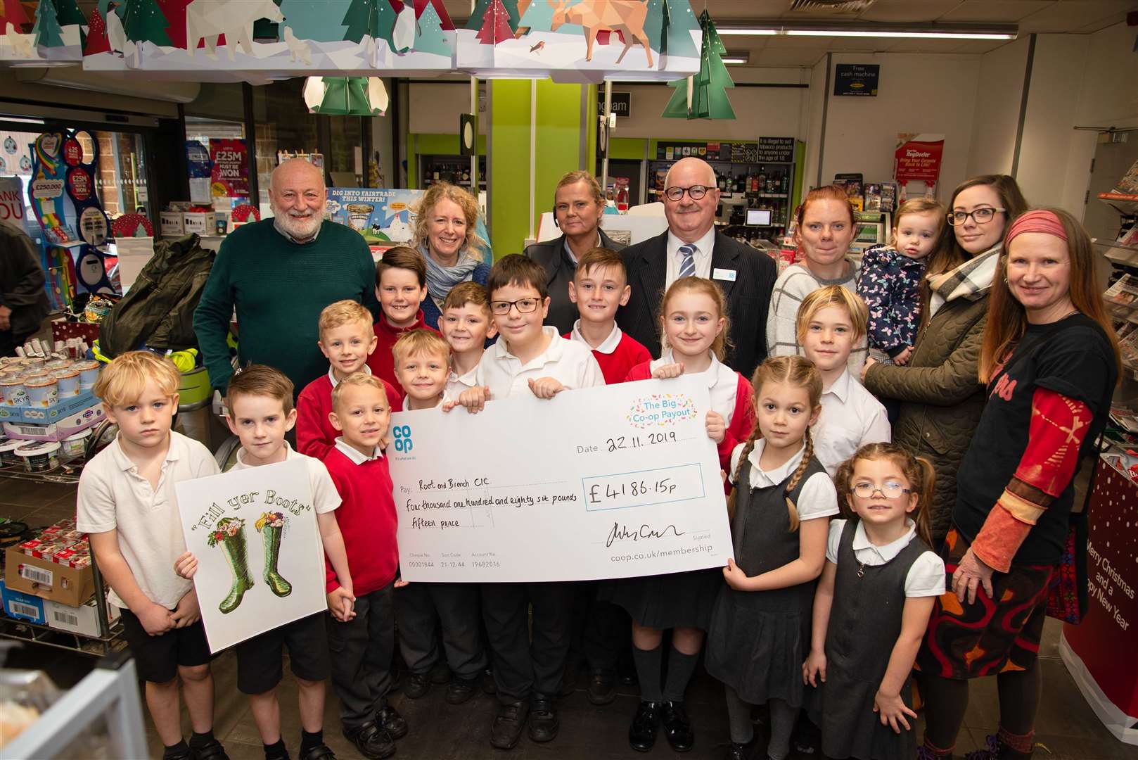 Kev Downham and Julie Fairhill from the Co-Op with Alex Wilby, Claire Crowley ,Shirley Young and Trevor Booth and pupils from Uppingham C of E Primary School. Photo: Alan Walters