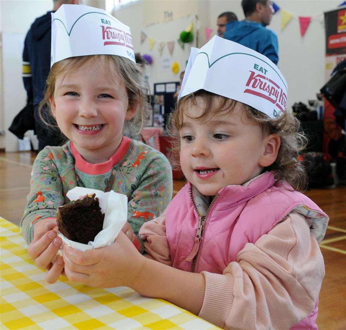 Harriet and Esme Pearson with cake. Photo: Chris Lowndes