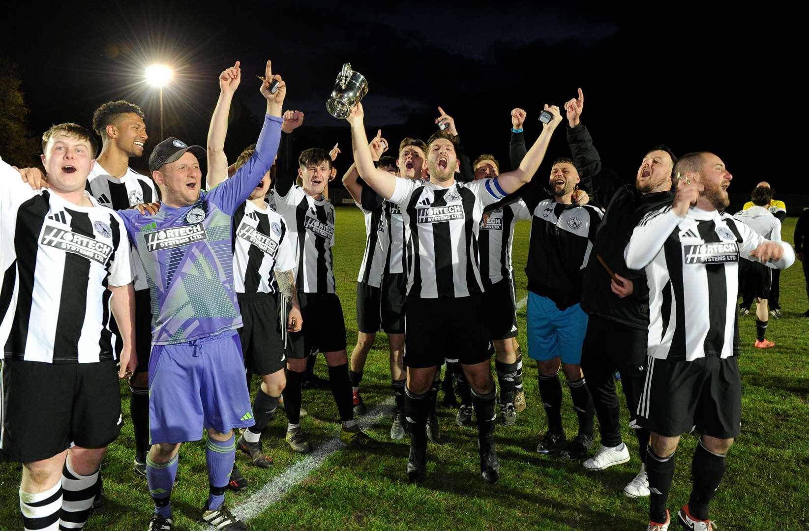 Long Sutton celebrate their success in the Spalding Inter-Services Cup final. Photo: Chris Lowndes