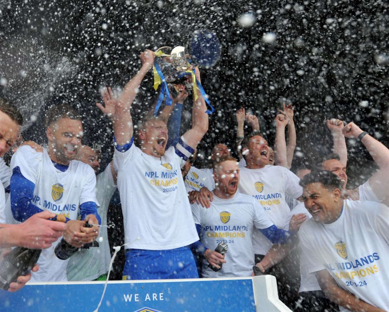 Skipper Nathan Stainfield lifts the trophy. Photo: Chris Lowndes