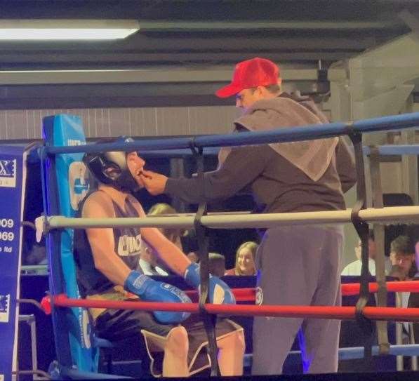 Lennon Gilbert in-between rounds with his trainer Esham Pickering.