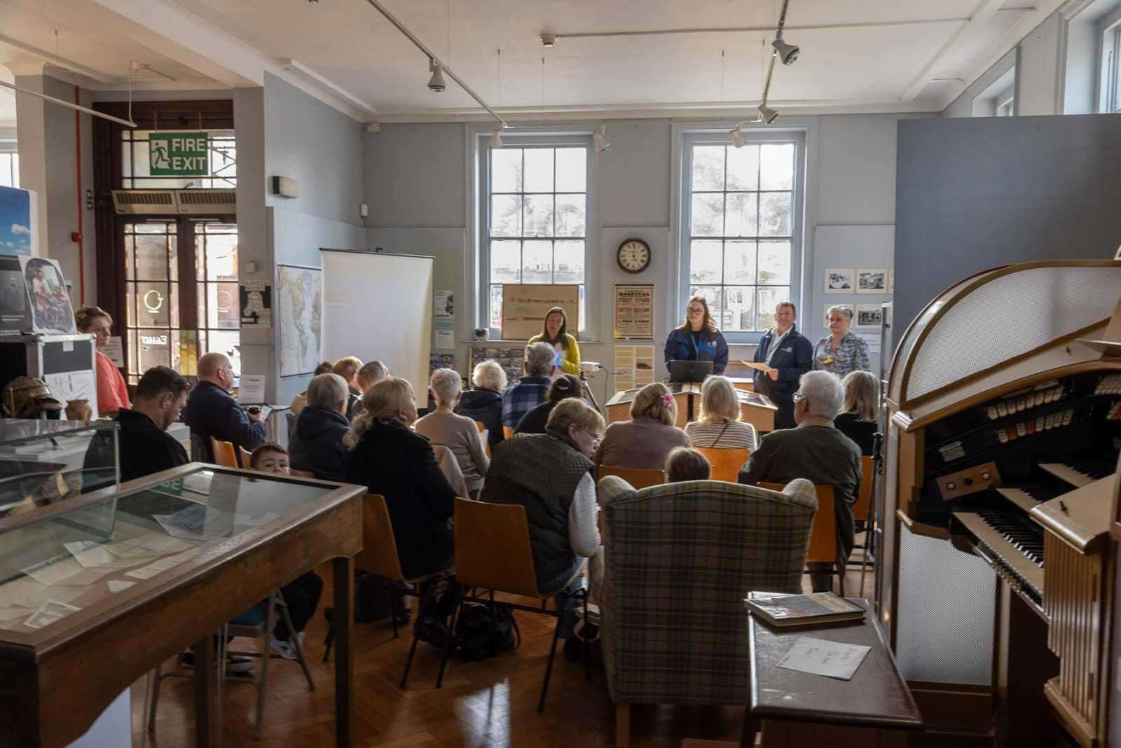 People at the exhibition talk