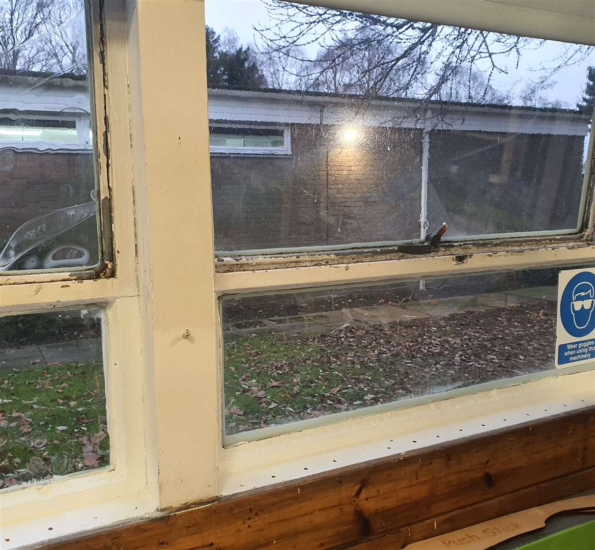 Peeling paint on a window sill. DEC 2024