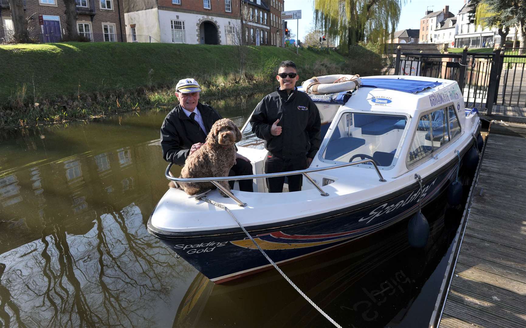 Spalding Water Taxi operations manager Anthony Grunwell with his dog Alfie and pilot Cean Alvarez launch the first boat of 2022.