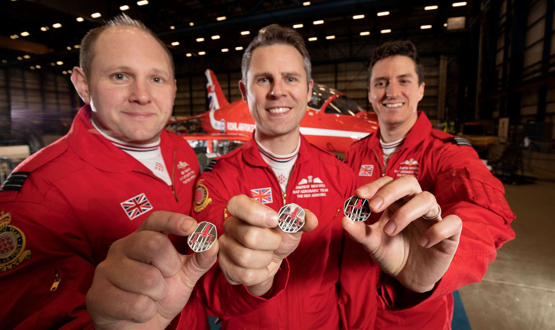The Red Arrows team proudly showing off the new 50p coin