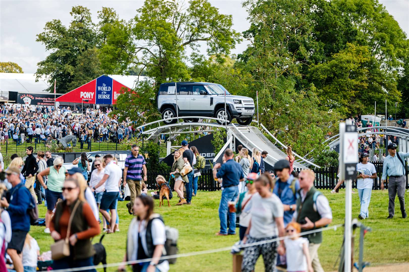 Spectators enjoying themselves at the Defender Burghley Horse Trials held in the parkland of Burghley House near Stamford in Lincolnshire in the UK on the 30th August to 3 September 2023.