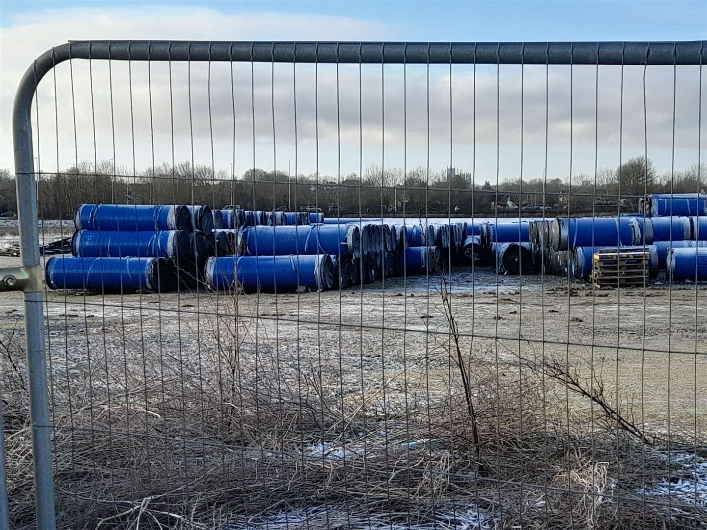 Dozens of pipes for delayed Anglian Water project, stored off Wragby Road in Lincoln - and there are similar scenes in Greatford and Glinton