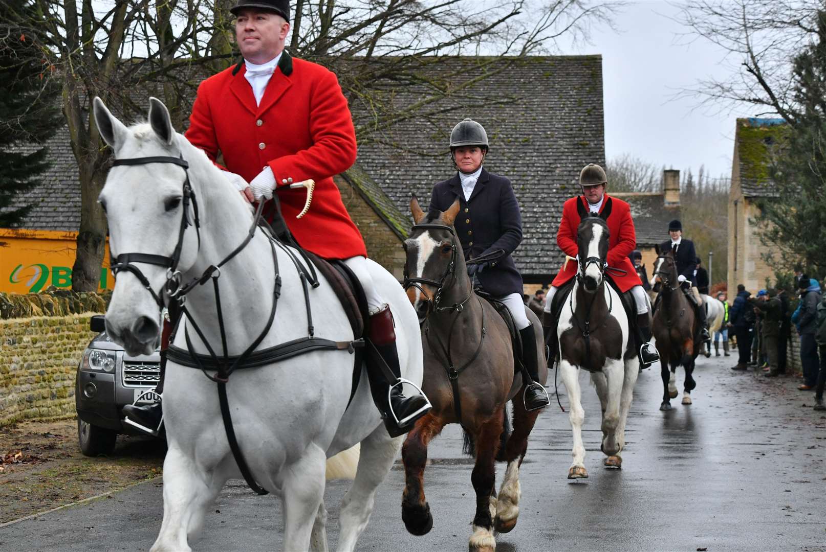 Hounds and riders leaving The Barn behind the Haycock Manor Hotel. Photo: David Lowndes