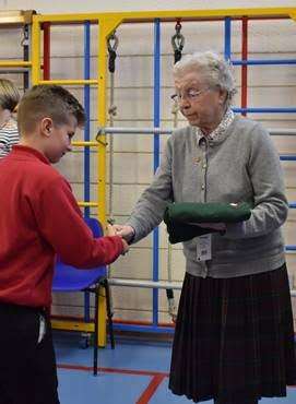 Nora Bryan hands sweatshirts to the new school council (5309236)