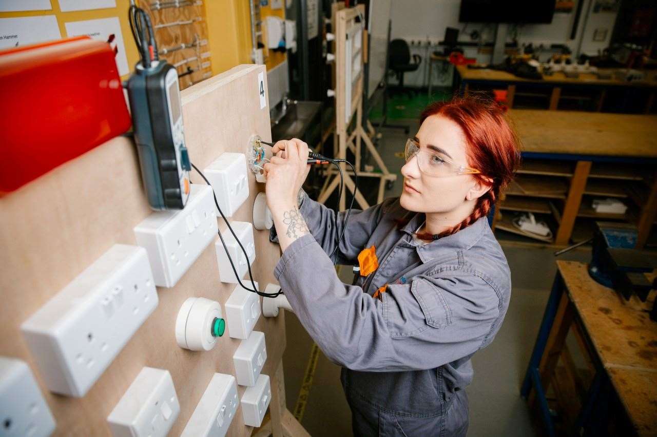 Engineering meets creativity as students design machines to lift blocks.