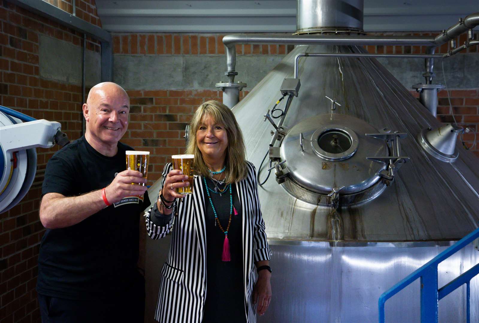 Cheers - Stuart & Jaclyn of Batemans Brewery raise a glass to 150 years Photo: BATEMANS BREWERY