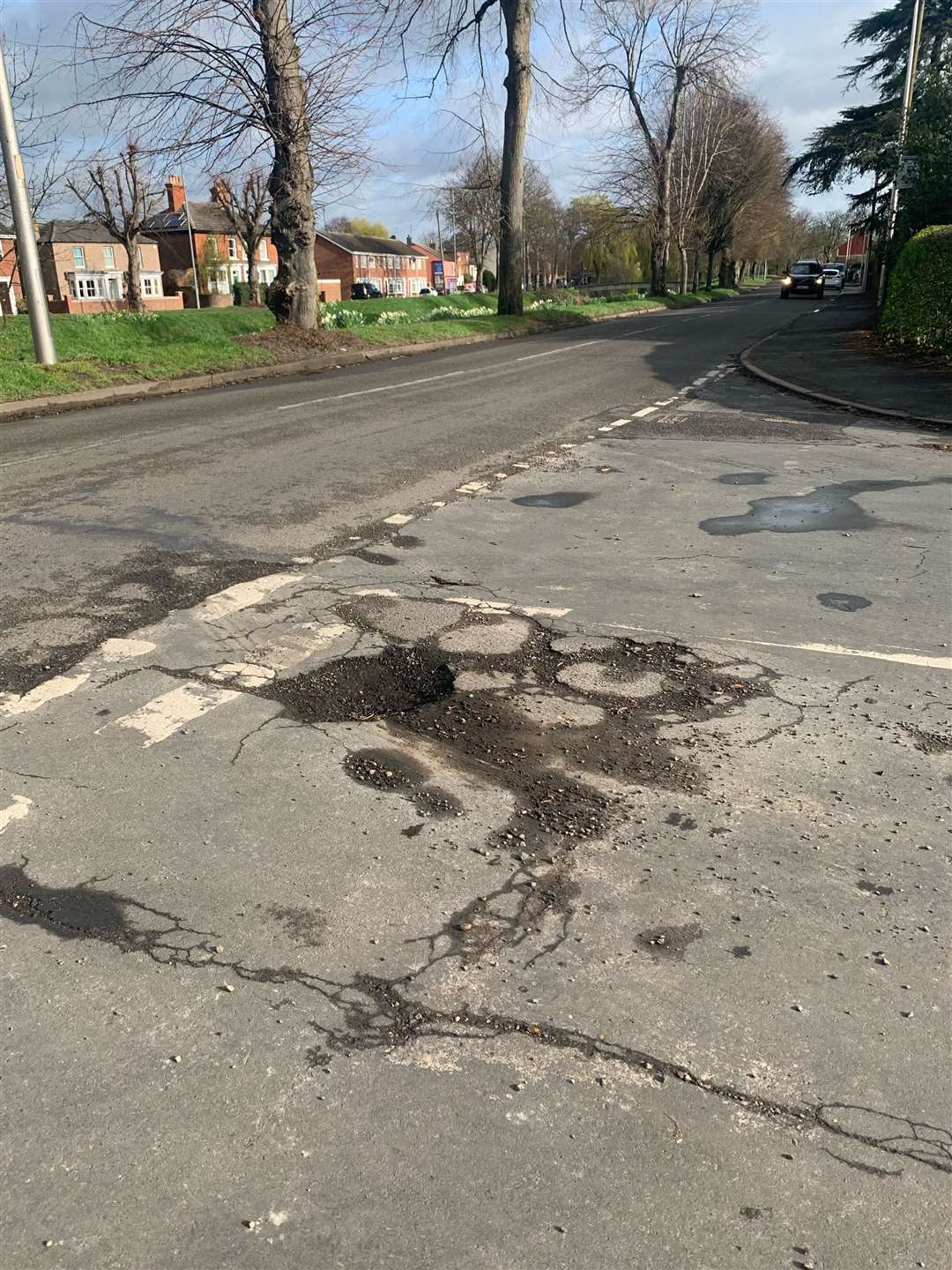 A deep pothole at the entrance to Churchill Drive, Spalding (45557447)