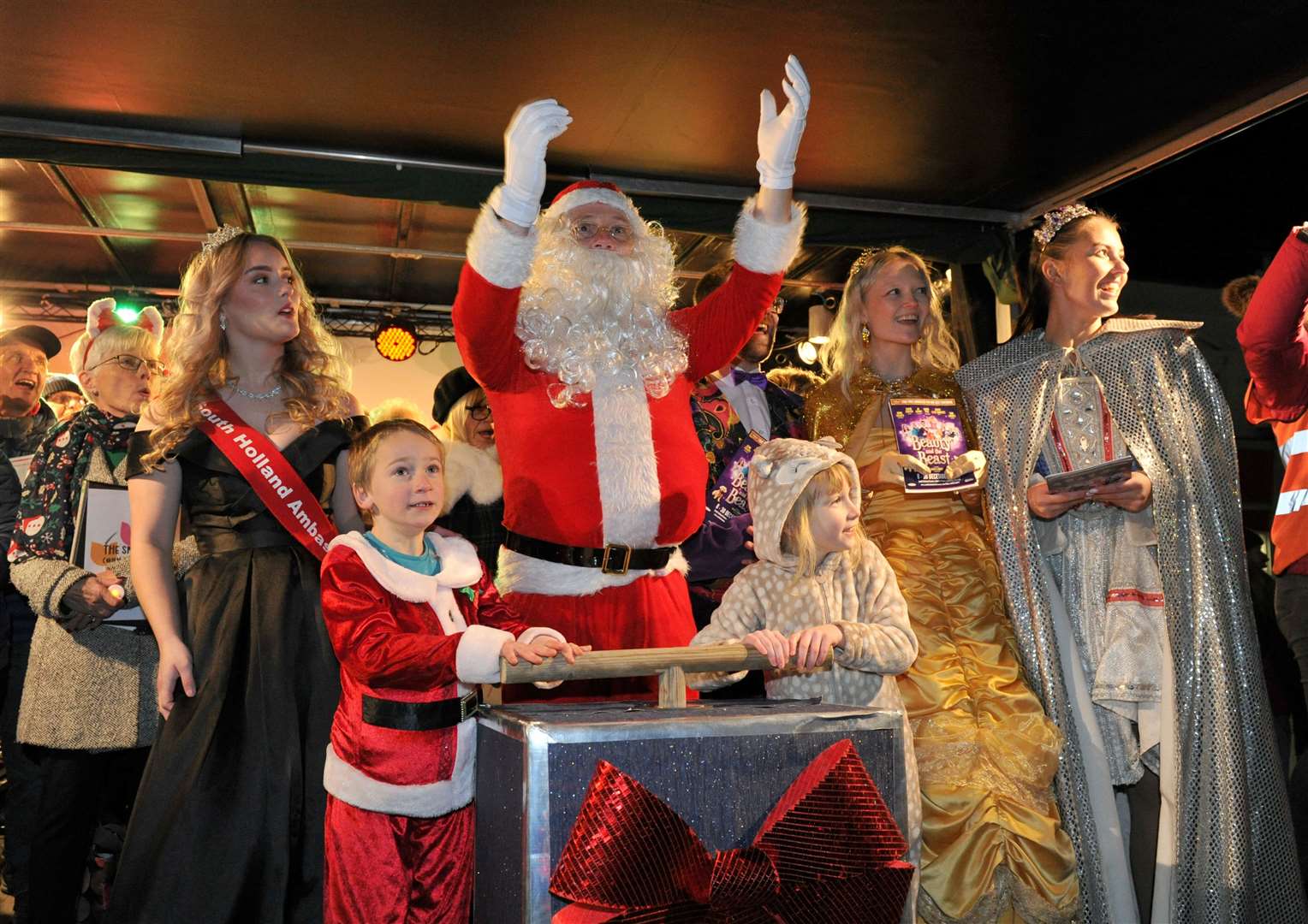 Twins Matty and Izzy Goble (7) switch on the lights with Santa