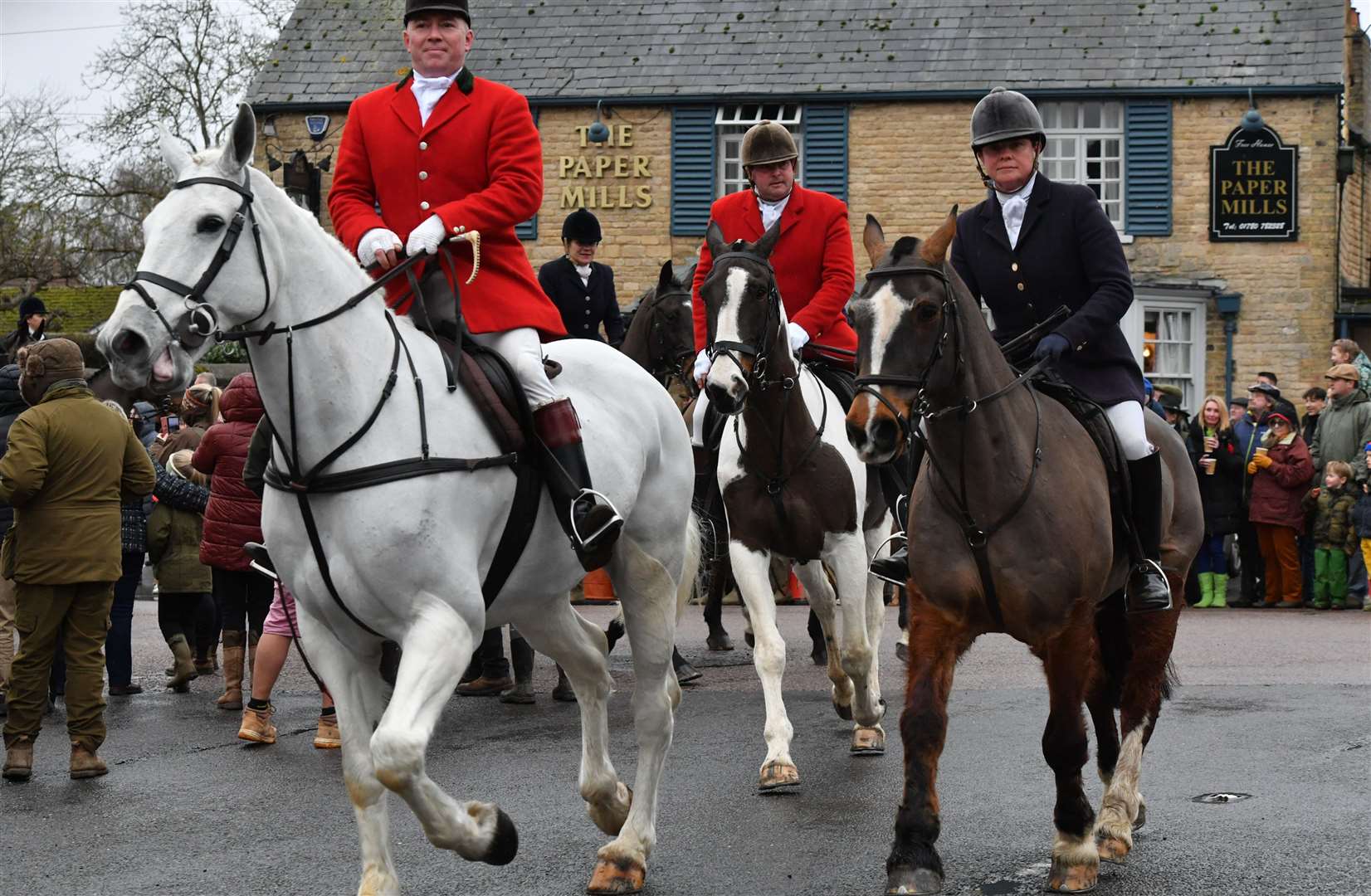 Hounds and riders arriving in the village. Photo: David Lowndes