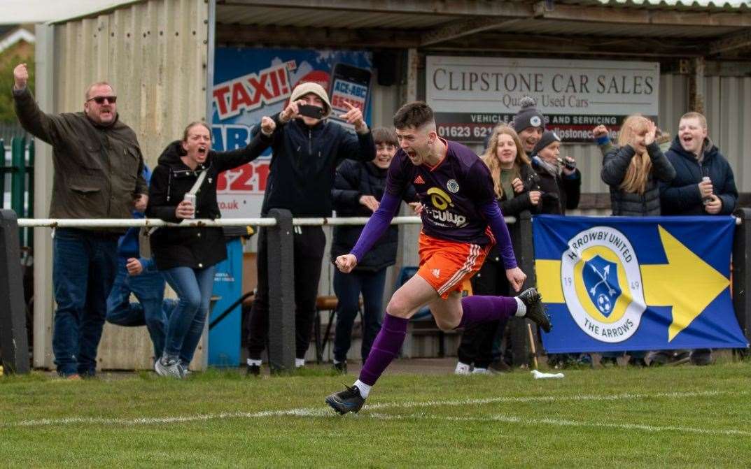 Harry Allcock races away after scoring the third goal. Photo: Steve Nesbitt @lincssnapper