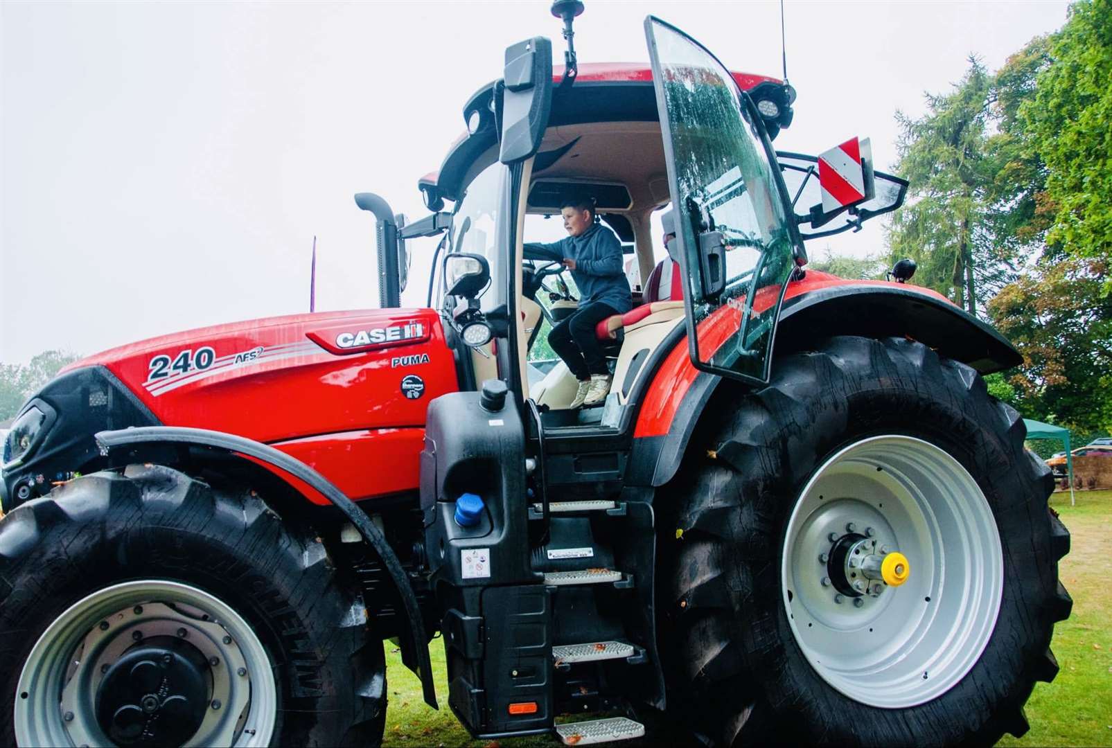 Councillor Neil Macer provided a red case tractor for the event. Photo: Deborah Knowles