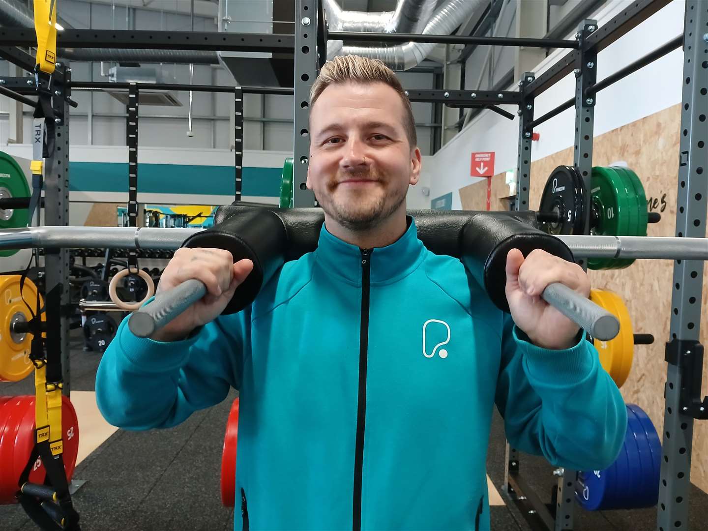 Assistant manager Rob Hope uses the assisted weightlifting bar