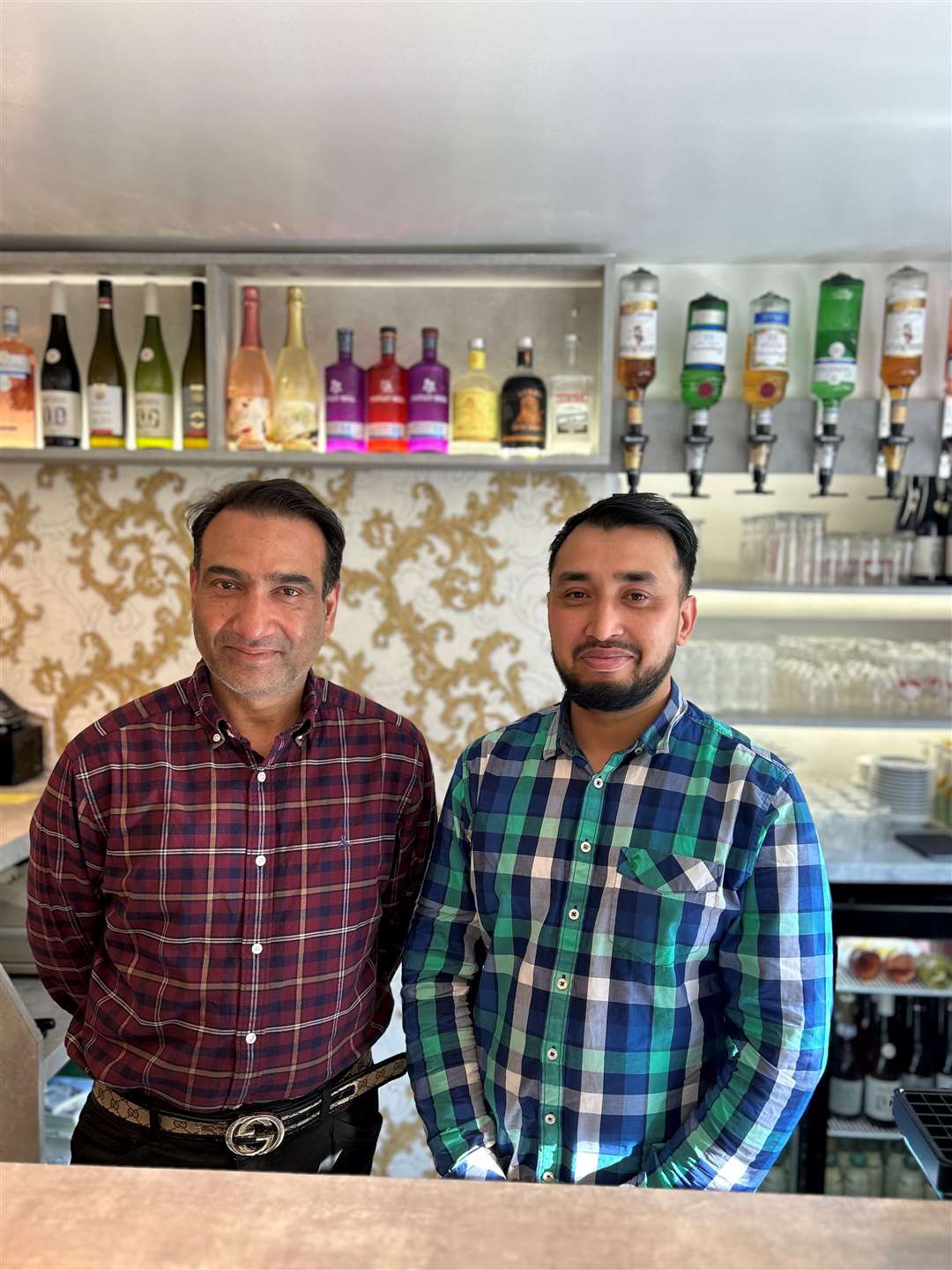 Owner of Bombay Cottage Habib Rahman with front of house and family member Harun Uddin