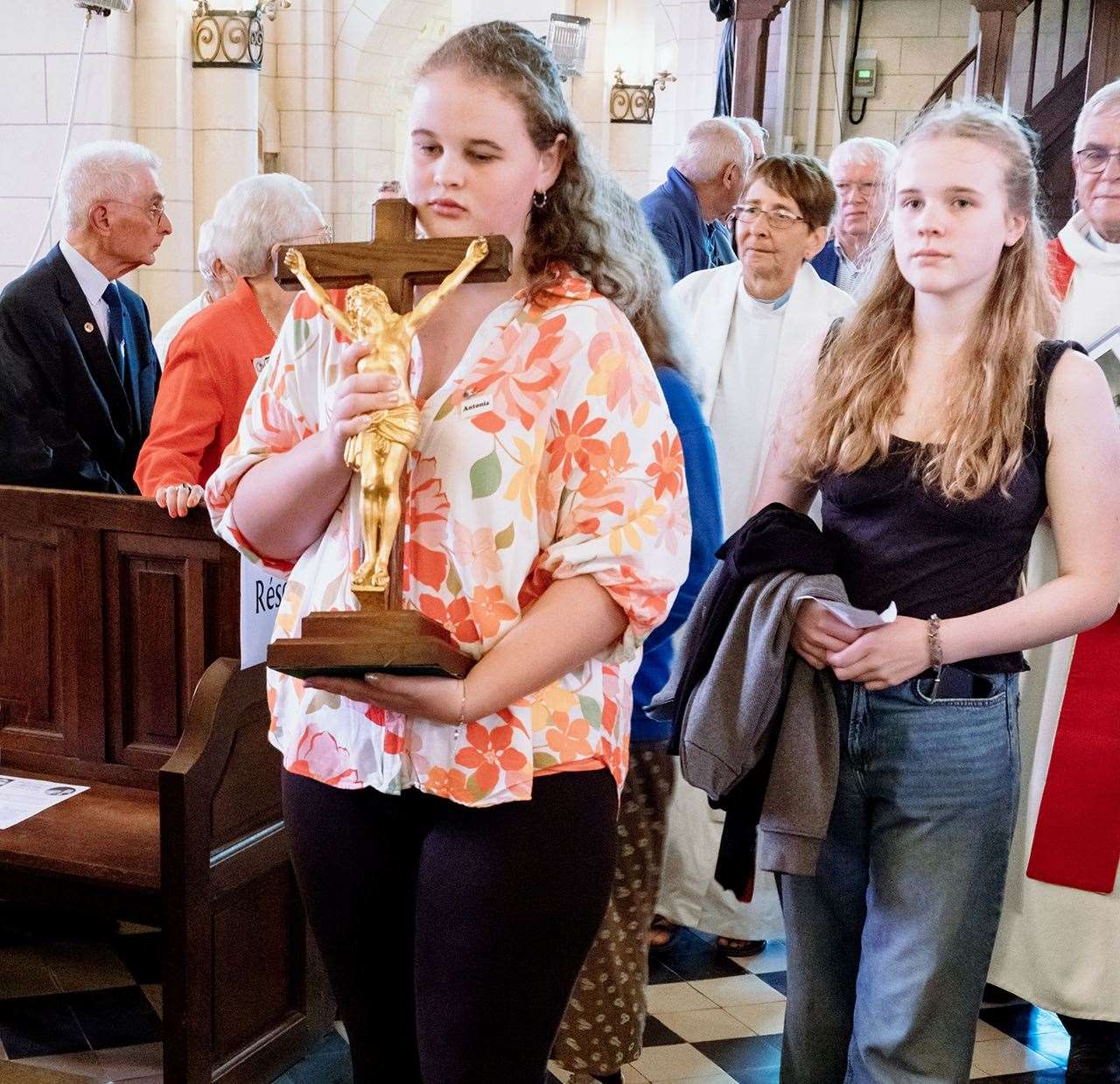 Tinwell children carry the cross to its new home. Photo: Chris Dodkin