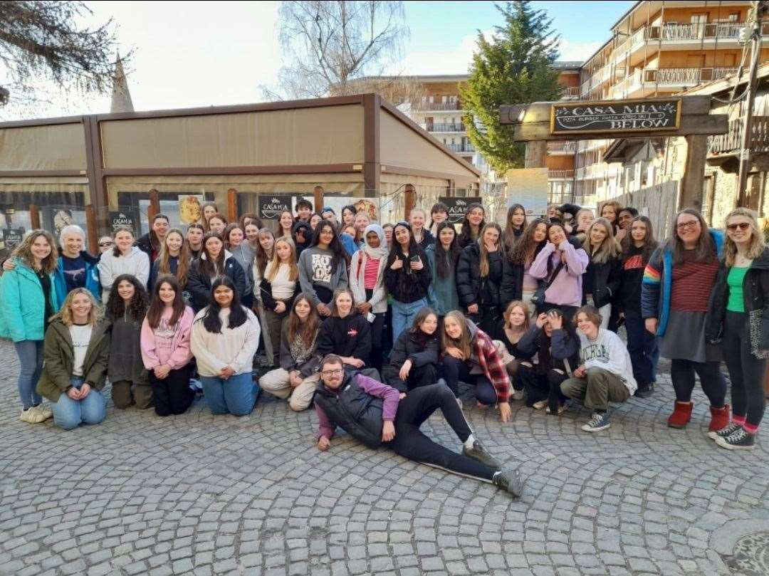Dave Stewart, front, takes a quick breather after arriving in the Italian Alps with a coach load of school pupils