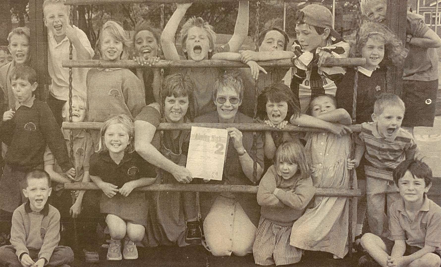 Trish Midgely and Viv Bradshaw with their quality award and the kids from the after school club Jimmy D's 25 years ago.