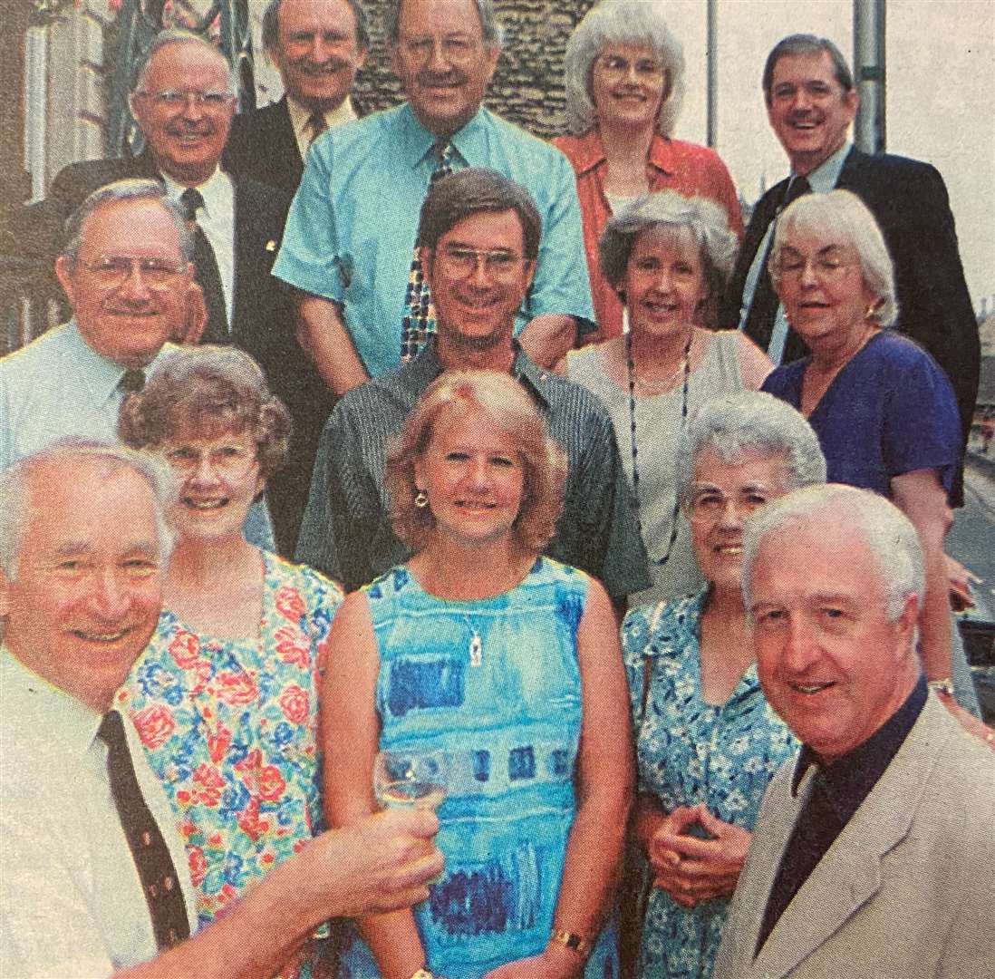 Dennis Seward toasts his career with Toni Jeffries and past mayors and officials 25 years ago.