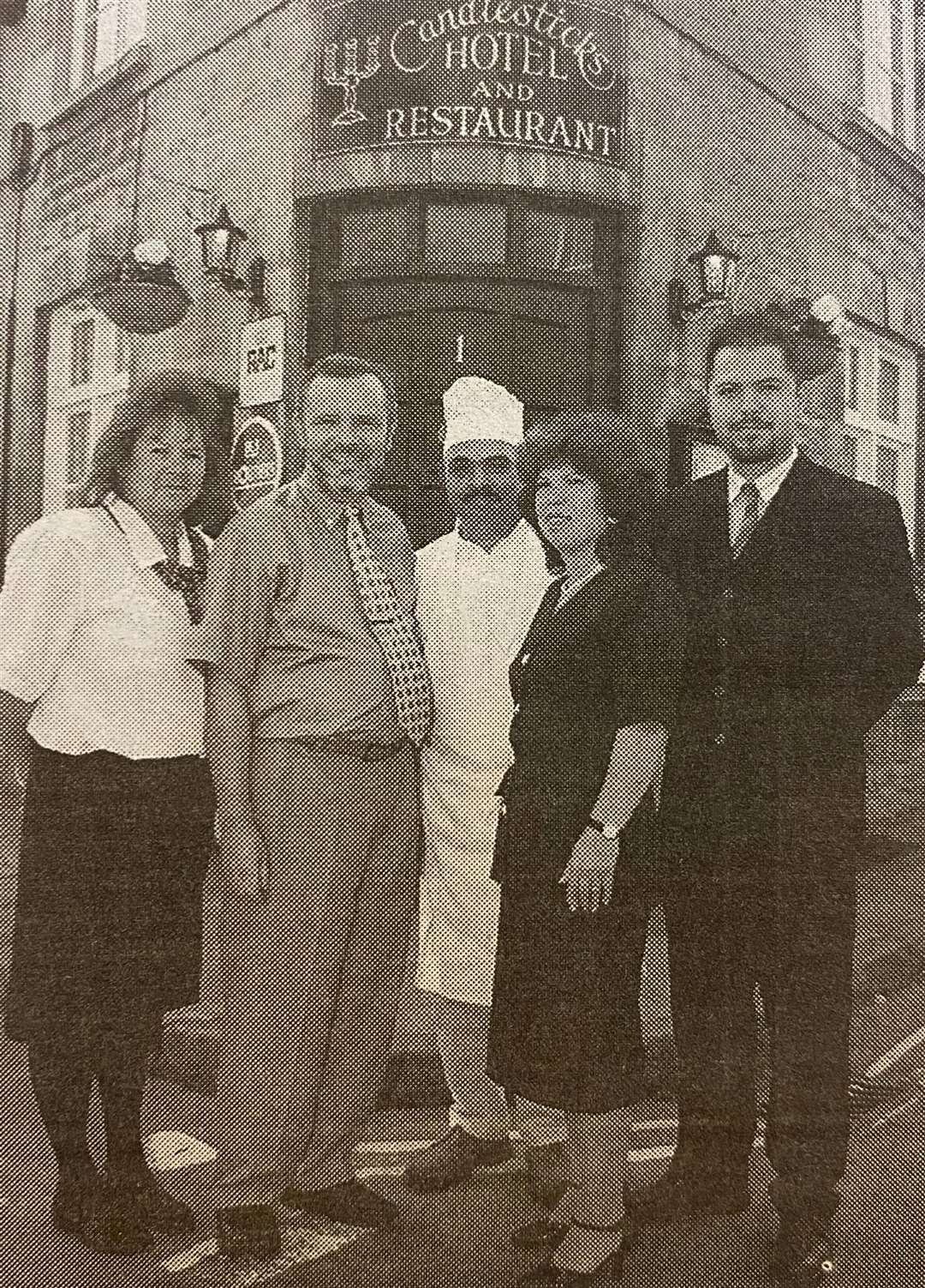 Celebrating 25 years at Stamford. Manuel Pinto, second from left, is joined by family and staff outside Candlesticks Hotel 25 years ago.