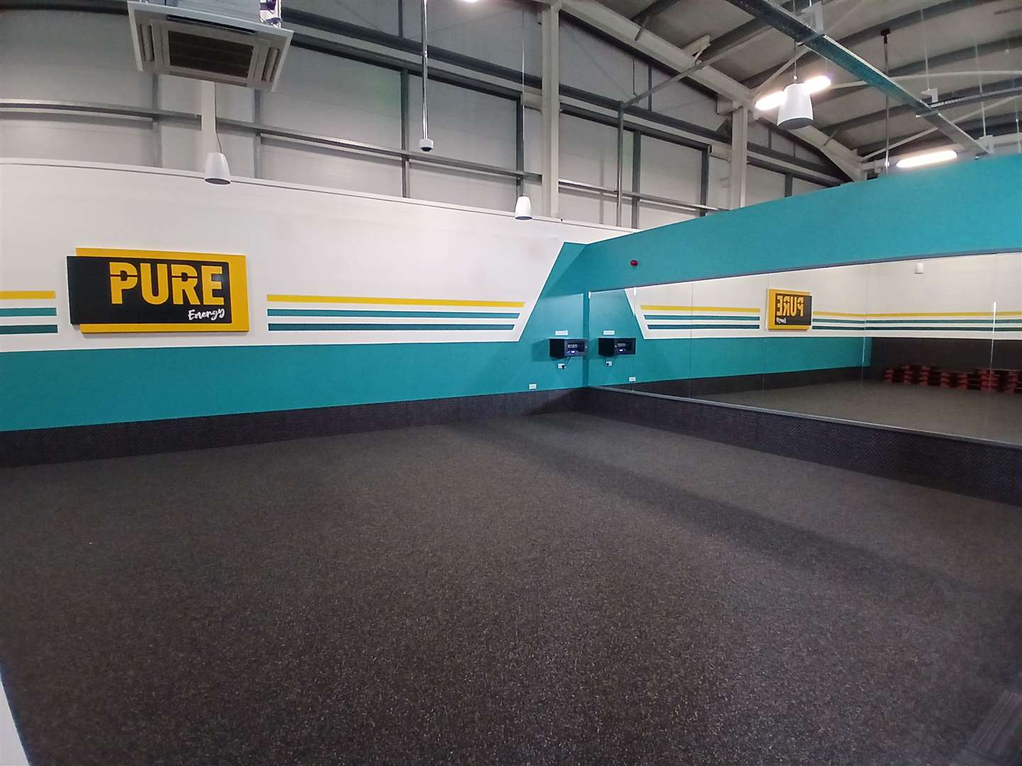 The studio is a separate space but is visible from the main gym area