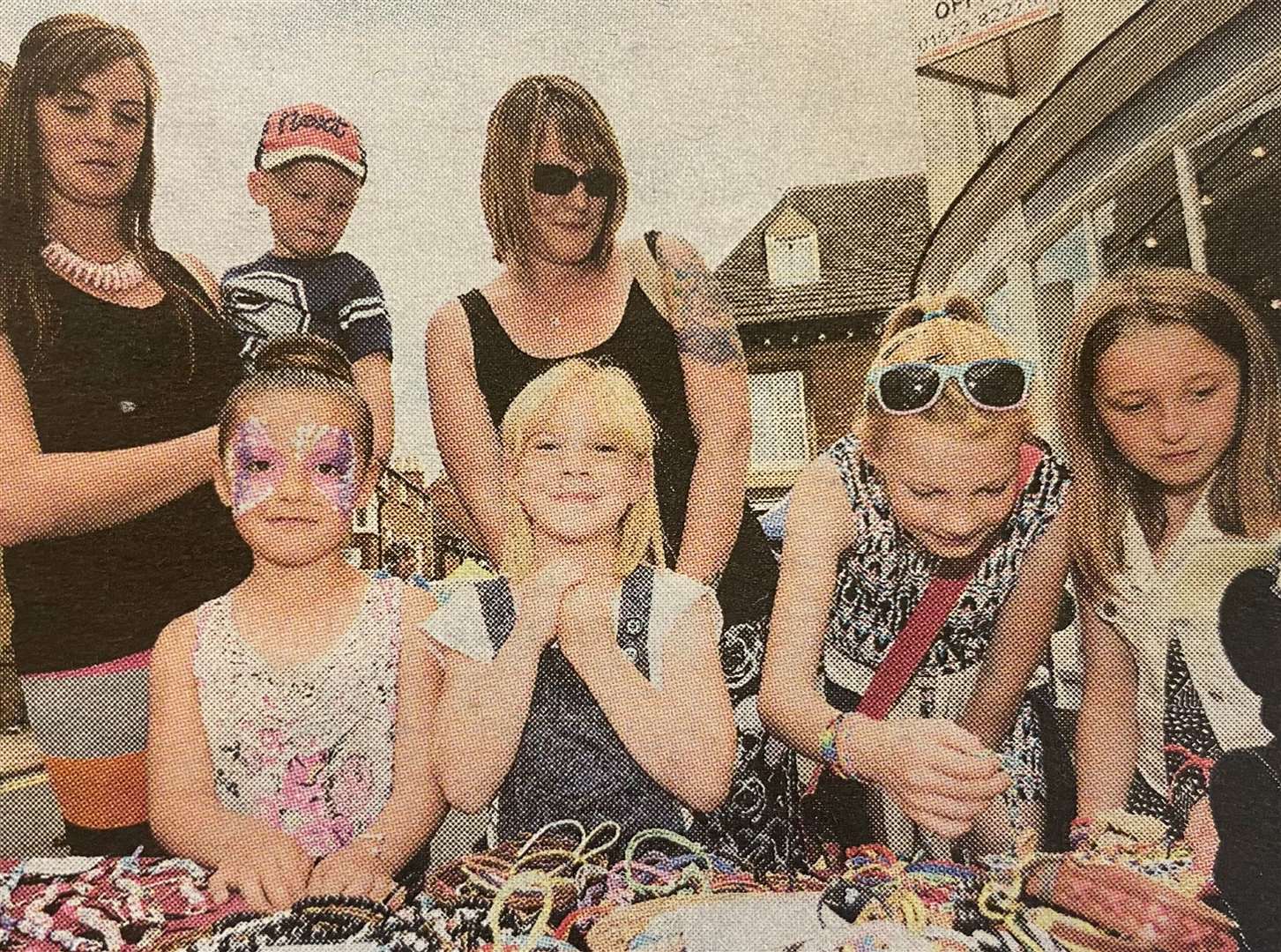 At the high street stalls, from left, Lilly, Connie, Alfie, Shannon and Lexi with Hayley and Leanne 10 years ago.