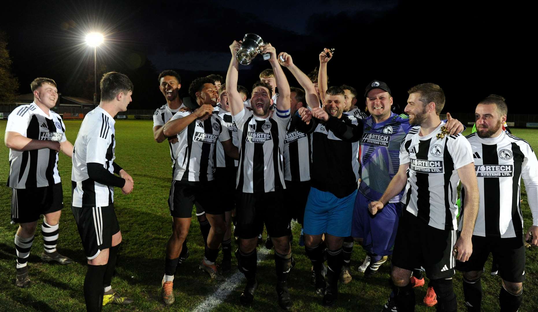 Long Sutton celebrate their success in the Spalding Inter-Services Cup final. Photo: Chris Lowndes