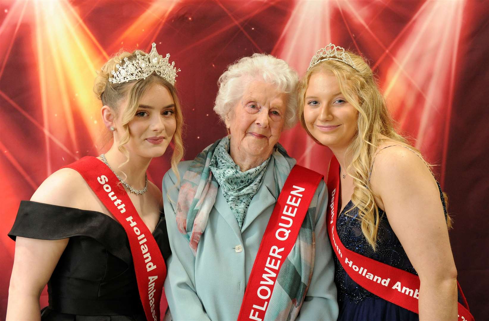 Jean Toolley centre with Star Perry and Holly Kendrick current Flower Queen and deputy