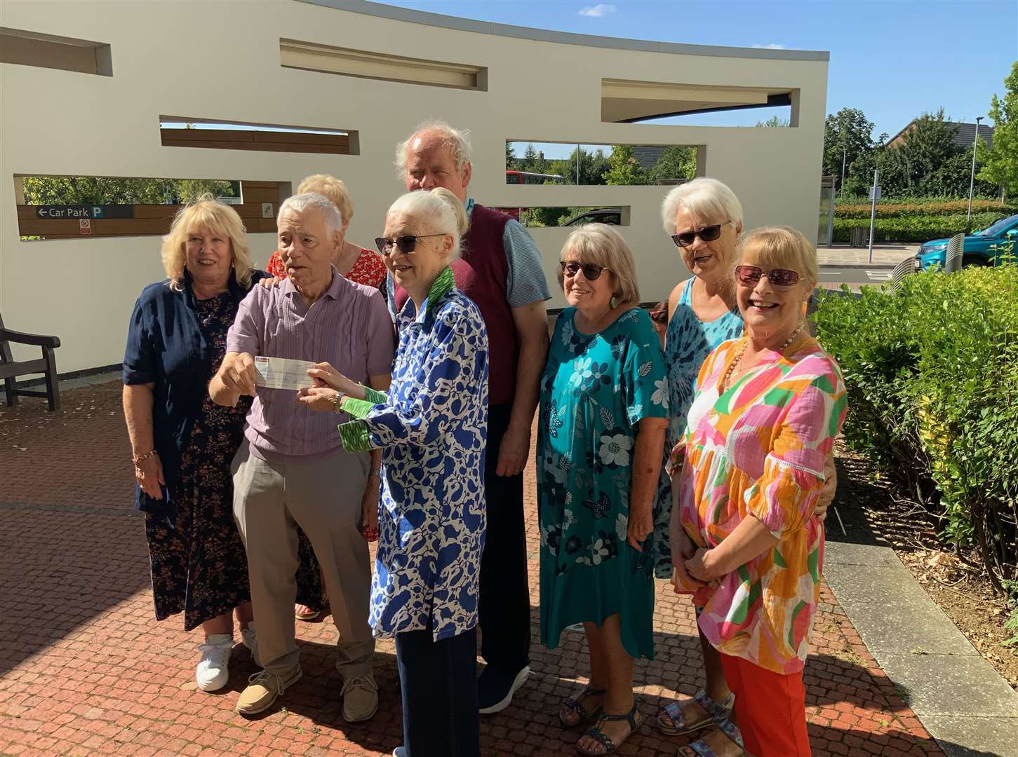 Christine Lawton, president, Friends of Johnson Community Hospital, accepts the cheque from members of the Dennis family. PHOTO: SUBMITTED