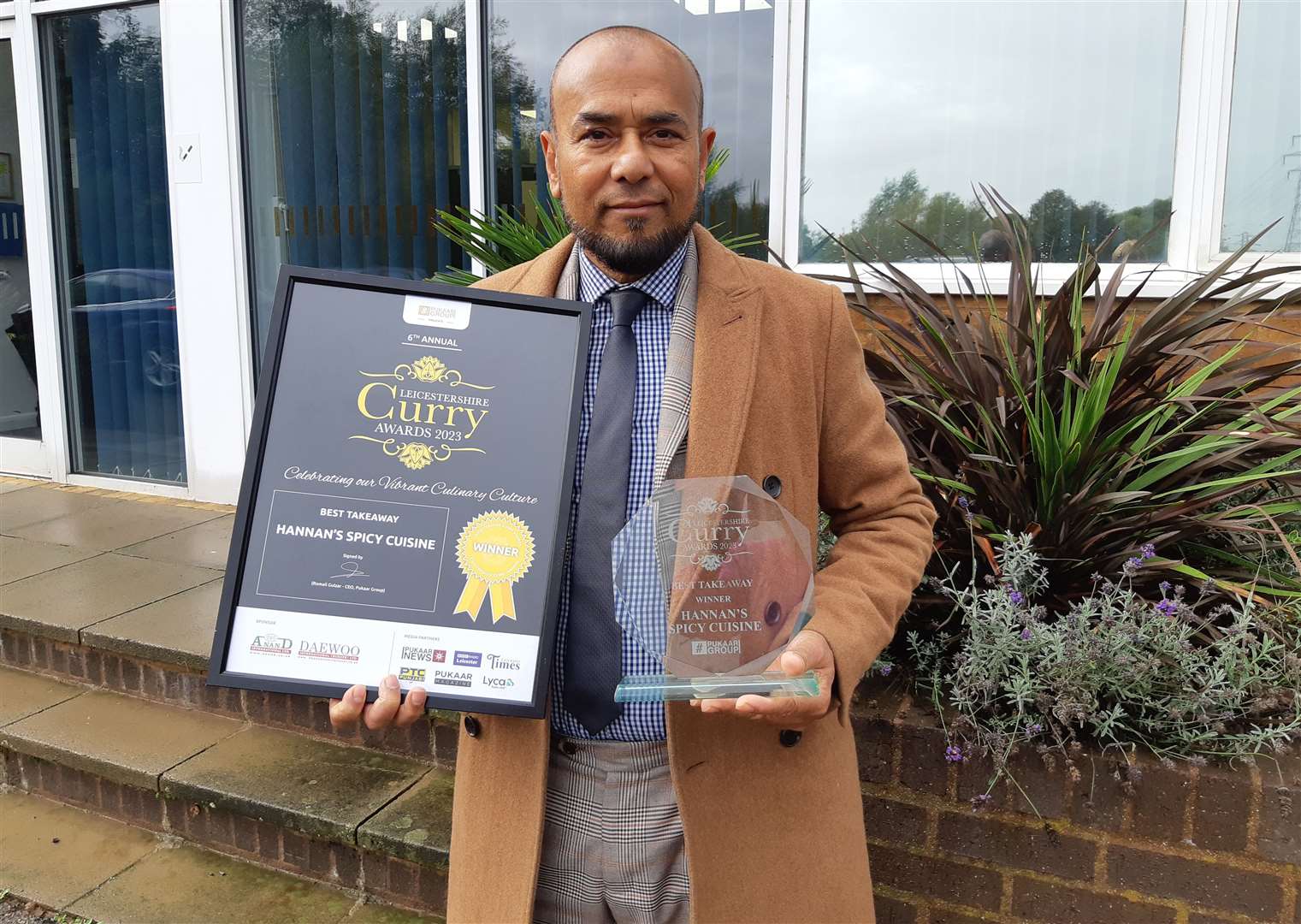 Abdul Hannan with his latest award for Hannan's Spicy Cuisine