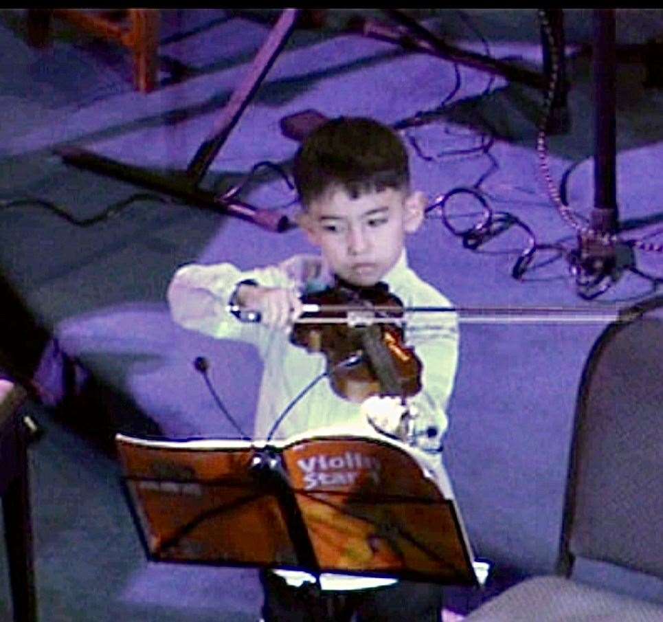 Angelo Arhip plays violin. Photo: Cameron-Reeves