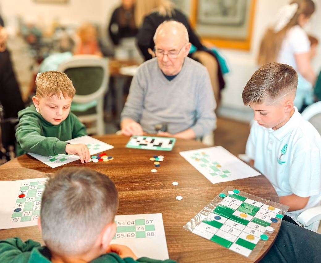 Pupils from Poplar Farm enjoyed bingo with residents at Newton House