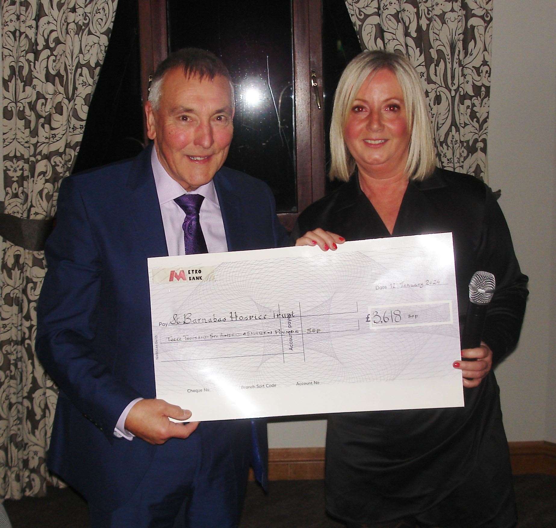 The cheque presentation of £3,618 to Deborah Yarwood, fundraising officer for St Barnabas.
