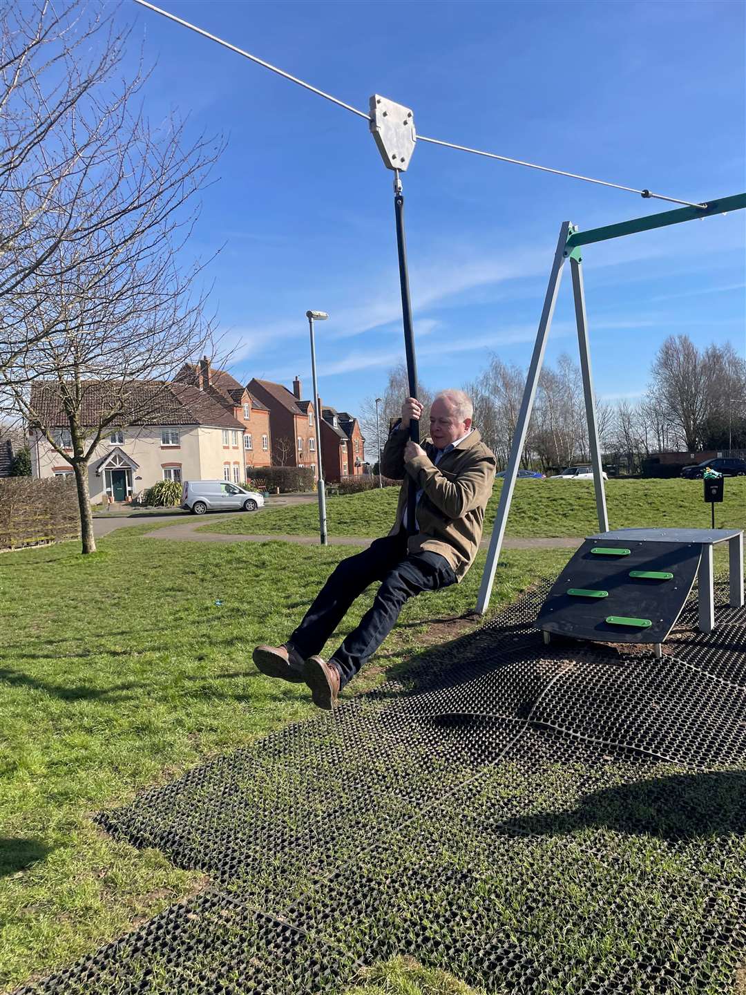 Lincolnshire county councillor Nigel Pepper enjoys a go on the zip wire