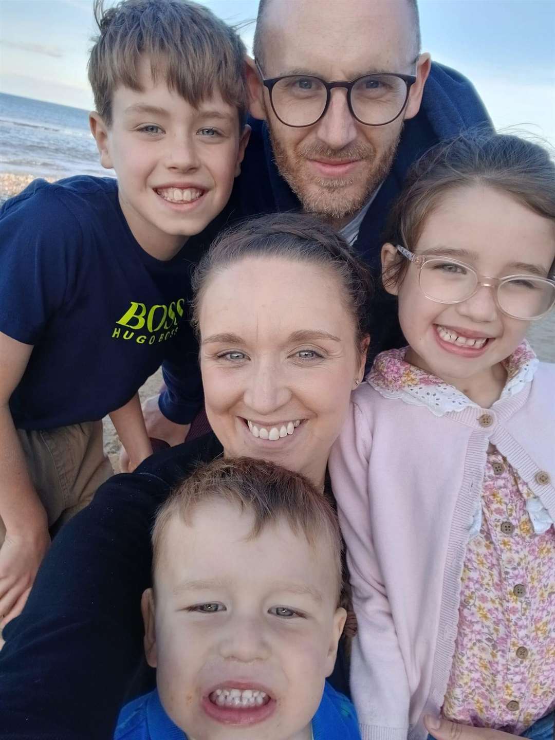 Andrew Hirst with his wife Rachael and children Freddie (top left), Juliana (right) and Maximilian (bottom).
