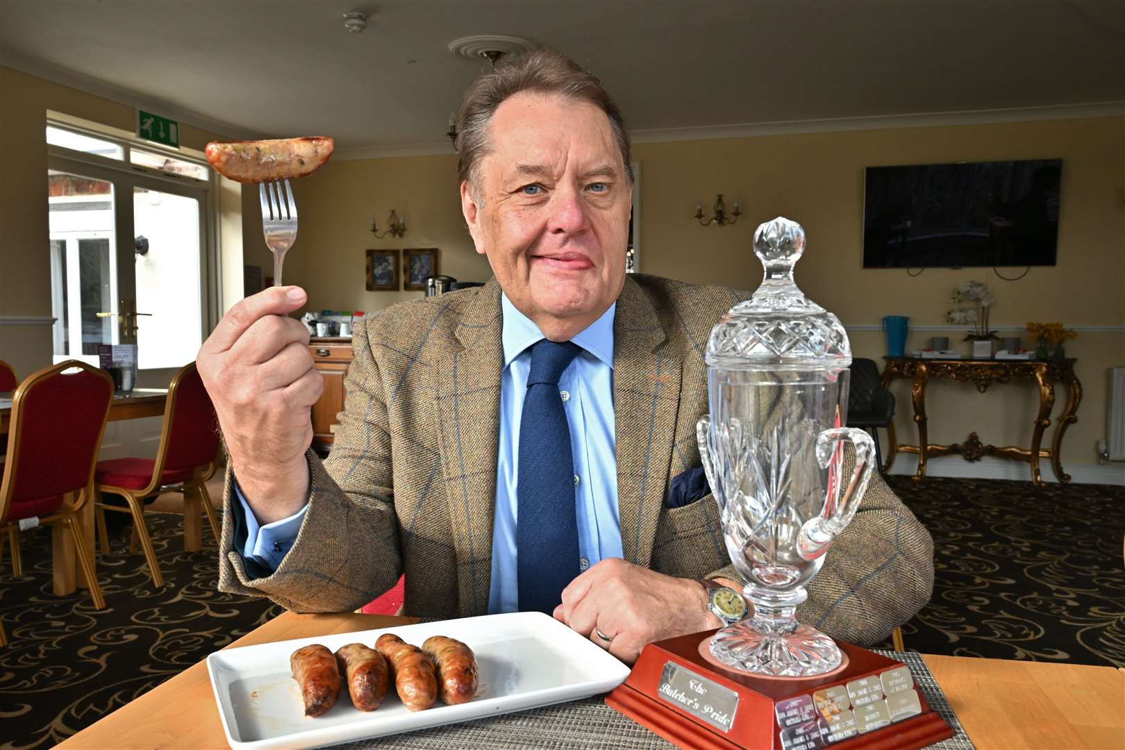 Butcher’s Pride hairman Sir John Hayes with the trophy. Photo: David Lowndes